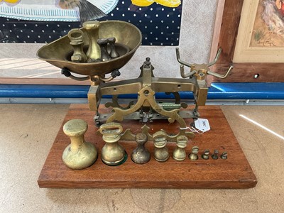 Lot 2406 - Set brass shop scales with weights on base