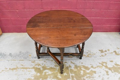 Lot 1389 - Late 17th century joined oak drop leaf dining table, with elliptical hinged top on turned and block understructure, 115 x 147cm extended