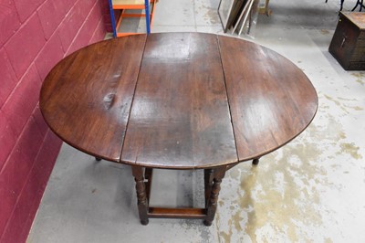 Lot 1389 - Late 17th century joined oak drop leaf dining table, with elliptical hinged top on turned and block understructure, 115 x 147cm extended