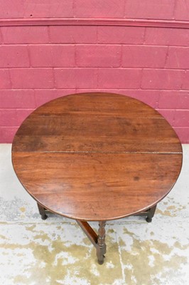 Lot 1389 - Late 17th century joined oak drop leaf dining table, with elliptical hinged top on turned and block understructure, 115 x 147cm extended