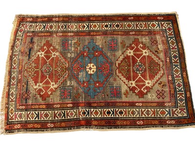 Lot 1420 - Small Kazak rug, with three conjoined medallions on geometric borders, 130 x 90cm