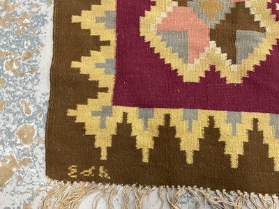 Lot 1424 - Large Kelim rug, with repeat cruciform motif on puce ground, signed, 310 x 197cm