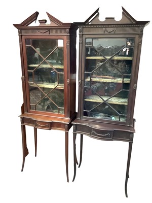 Lot 1276 - Pair of early 20th century Chippendale revival display cabinets, each with broken arch pediment and shelved interior enclosed by astragal glazed door, on bowed reeded frieze and slender square spla...