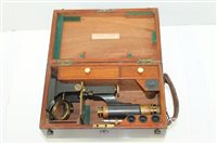 Lot 3696 - Victorian brass mounted microscope with lenses...