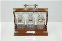 Lot 3641 - Early 20th century oak three-bottle tantalus...