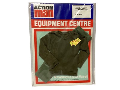 Lot 5 - Palitoy Action Man equipment Centre Army Jersey & Trousers No.34285 and Miro Meccano Ratelier D'Armes Rifle Rack Ref:534202, both on card  (2)
