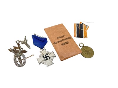 Lot 727 - Nazi German Faithful Service Decoration (25 years), together with paper envelope, a Nazi War Merit medal and three Scottish clan badges (5).