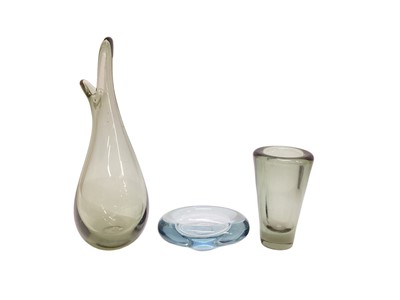 Lot 1129 - Four Danish Holmegaard glass items to include duckling beak vase, another vase and two small bowls, all signed