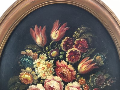 Lot 84 - French School mid 20th century, oval oil on canvas - A still life of summer flowers in a vase, in gilt frame. 48 x 38cm.