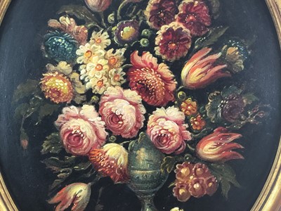 Lot 84 - French School mid 20th century, oval oil on canvas - A still life of summer flowers in a vase, in gilt frame. 48 x 38cm.