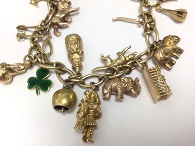 Lot 65 - 9ct gold charm bracelet with eighteen various gold, yellow metal and silver charms