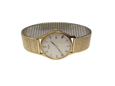 Lot 69 - Seiko 9ct gold cased calendar quartz wristwatch on gold plated expandable strap