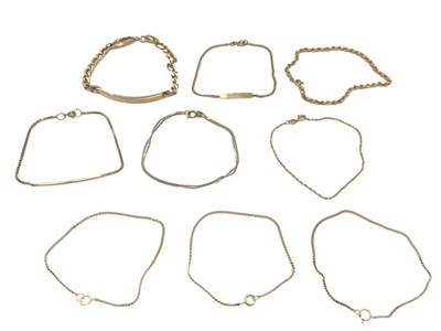 Lot 93 - Nine 9ct gold bracelets including two identity bracelets, a rope twist chain and trace chains