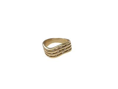 Lot 114 - 18ct yellow gold ring with four waved bands set with eleven brilliant cut diamonds