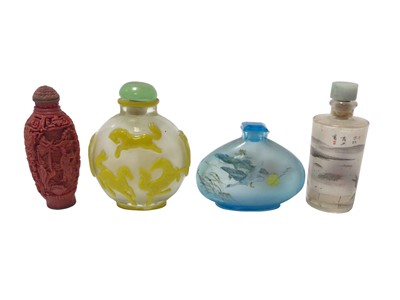 Lot 859 - Peking style overlay glass snuff bottle, 8cm high, three others