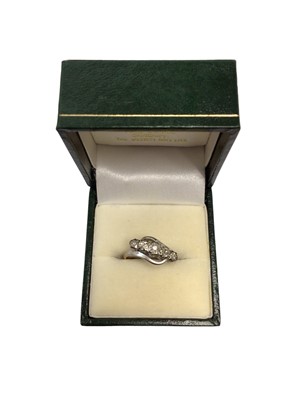 Lot 119 - Diamond five stone cross over ring