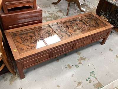 Lot 1267 - Oriental carved hardwood coffee table with inset glass top.