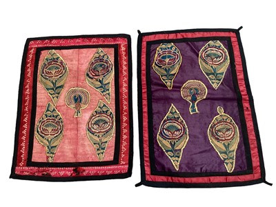Lot 2068 - 19th century Rajasthan India textiles, a pair of silk panels with appliqued flowers and peacocks in tiny chaain stitch, plus a small silk apron with embroidered birds and flowers.