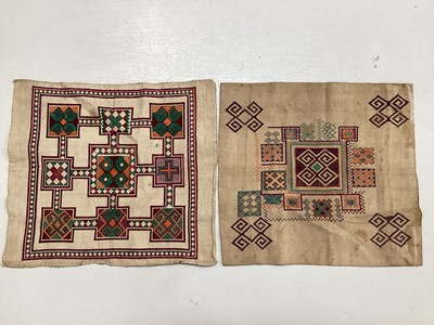 Lot 2069 - A selection of vintage textiles including an East European patchwork cover with geometric cross stitch panels connected with bobbin lace, small velvet patchwork panel, Iranian printed cotton cover...