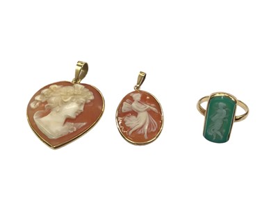 Lot 1016 - Two carved cameos in 18ct gold pendant mounts and a yellow metal cameo ring (3)