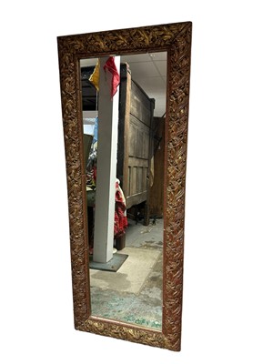 Lot 1396 - Victorian-style gilt framed narrow mirror with foliate design