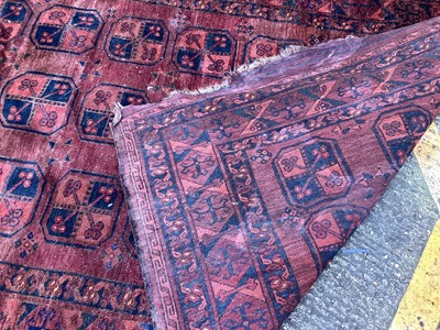 Lot 1438 - Antique Persian design rug with geometric medallions on dark red ground