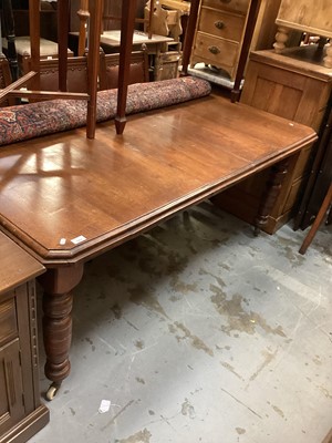 Lot 1271 - Edwardian mahogany extending dining table on turned legs and castors