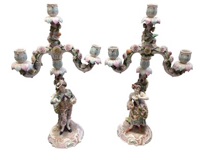 Lot 320 - Pair of 19th century Dresden figural porcelain candelabra with floral encrusted decoration