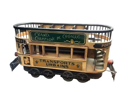 Lot 390 - Decorative French painted wooden and metal model of a tram decorated with advertising banners