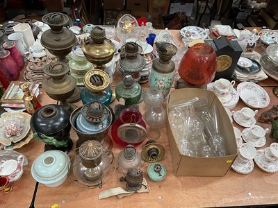 Lot 488 - Group of assorted oil lamps and parts including shades and chimneys.