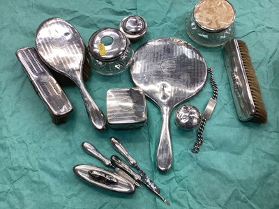 Lot 1107 - Silver dressing table jars, brushes and similar dressing table pieces.