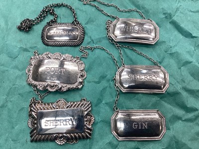 Lot 1100 - Group of Georgian and later silver wine and spirit labels. (6)