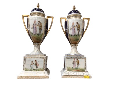 Lot 88 - Pair of Continental porcelain urns and covers on plinths, decorated with romantic figures