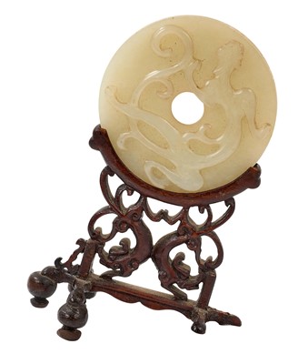 Lot 760 - Celadon jade chilong bi disc, probably 19th century