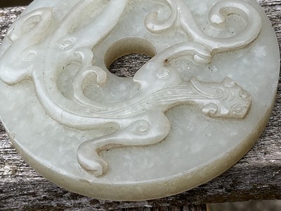 Lot 760 - Celadon jade chilong bi disc, probably 19th century