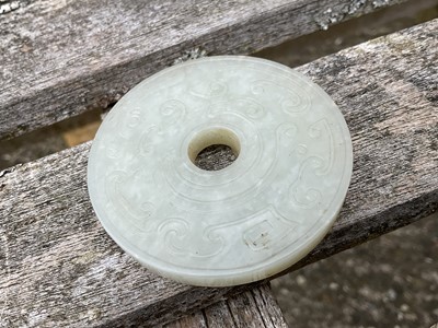 Lot 760 - Celadon jade chilong bi disc, probably 19th century