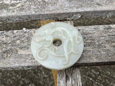 Lot 760 - Celadon jade chilong bi disc, probably 19th century