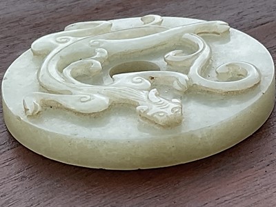 Lot 760 - Celadon jade chilong bi disc, probably 19th century