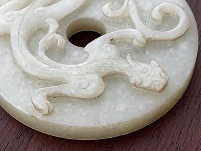 Lot 760 - Celadon jade chilong bi disc, probably 19th century