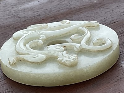 Lot 760 - Celadon jade chilong bi disc, probably 19th century