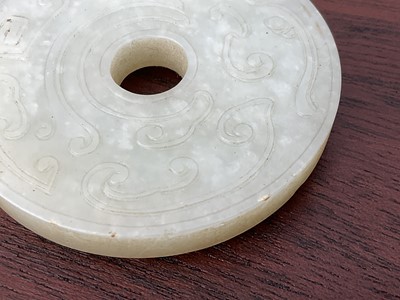 Lot 760 - Celadon jade chilong bi disc, probably 19th century