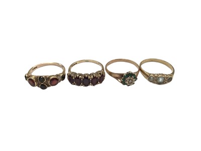 Lot 1032 - Four 9ct gold and gem set dress rings