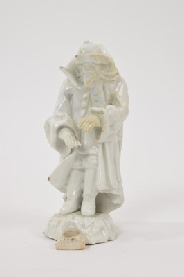 Lot 15 - 18th century white glazed porcelain figure of a man in a greatcoat, losses and restoration