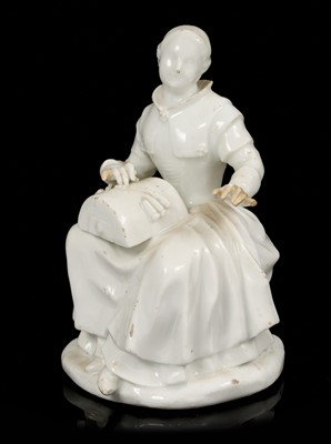 Lot 14 - White glazed porcelain figure of a lacemaker