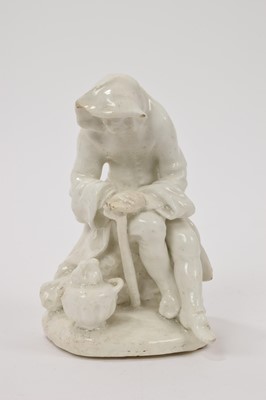 Lot 23 - Bow white glazed porcelain figure of a man before a brazier emblematic of winter, probably Longton Hall