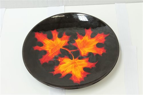 Lot 2108 - Poole Pottery Forest Flame charger, decorated...