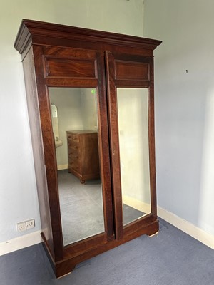 Lot 1393 - Edwardian mahogany wardrobe with twin mirrored doors enclosing hanging space