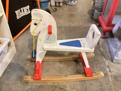 Lot 281 - Vintage wooden rocking horse together with a Chad Valley push a long (2)