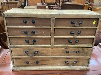 Lot 1208 - Antique pine nest of drawers with brass swan neck handles