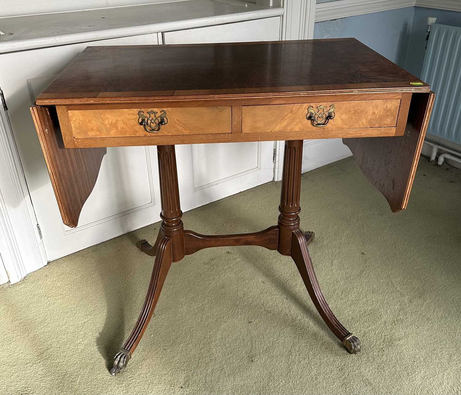 Lot 1224 - Regency-style walnut and burr wood sofa table on fluted supports